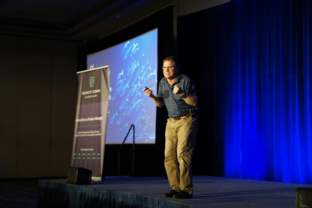 confident public speaker on stage