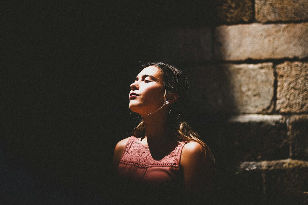 person doing breathing exercise